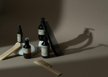 Displaying moisture - minimalist display of beauty products, combs, and natural elements on a neutral background. for mois...