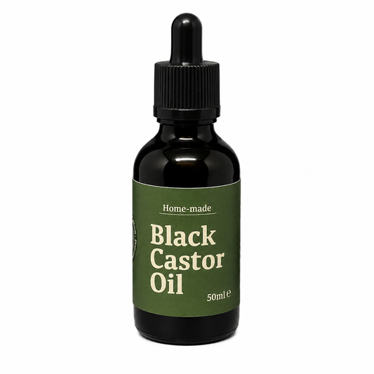 A 50ml glass dropper bottle of Black Castor Oil with a dark green label and black dropper cap, set against a plain white background.