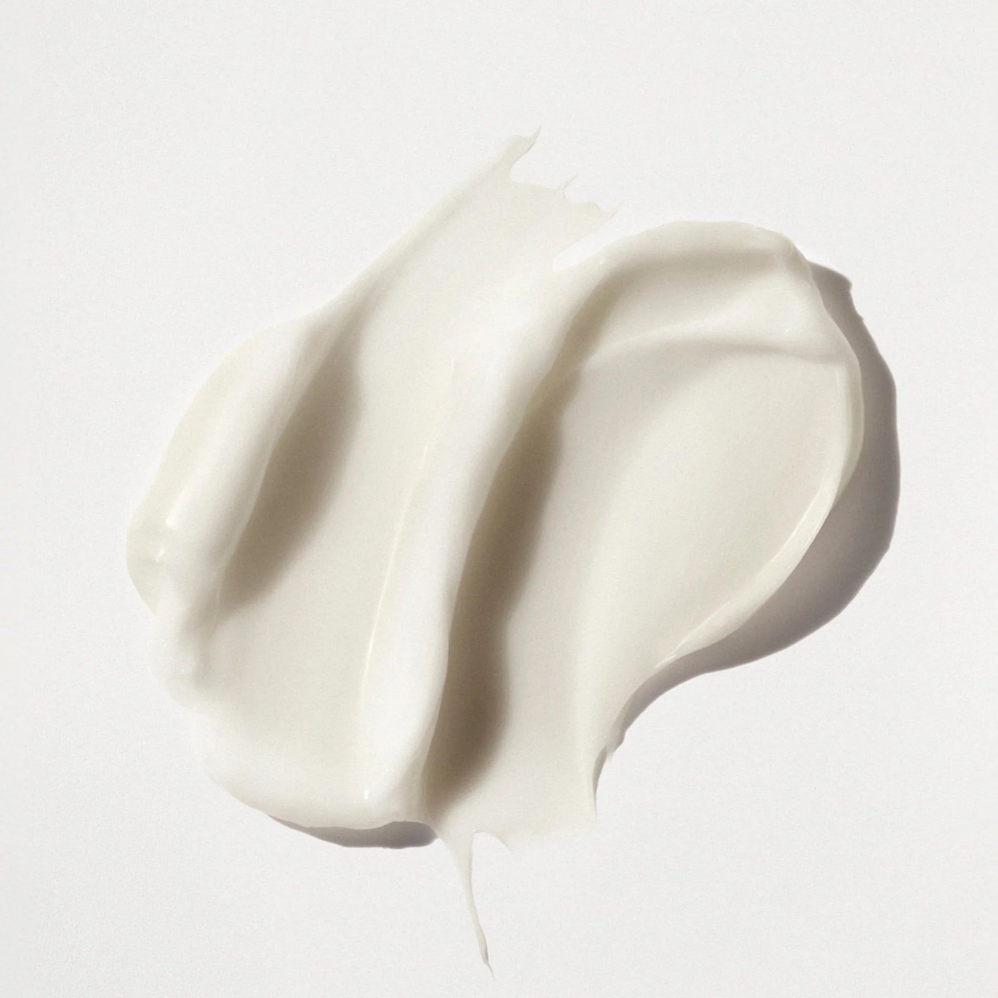 White cream swatch on a light gray background