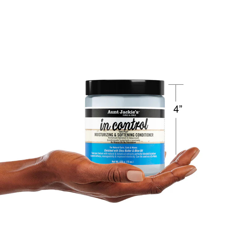 Aunt Jackie's in control conditioner jar held in a hand with a white background