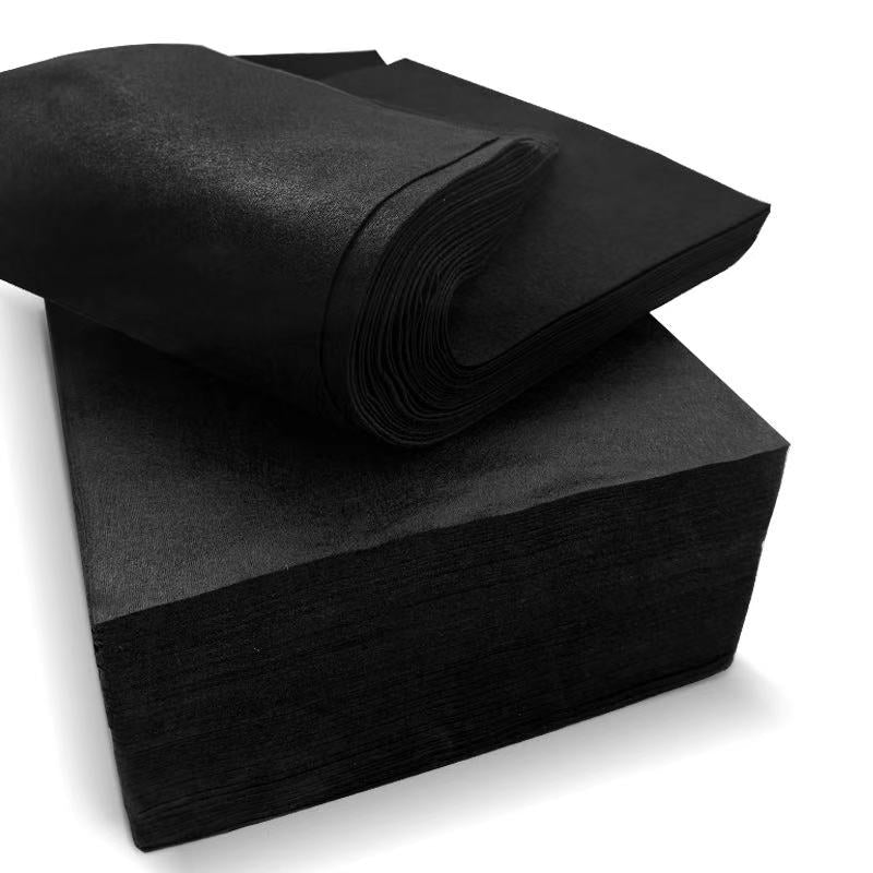 Black fabric sheets on a white background