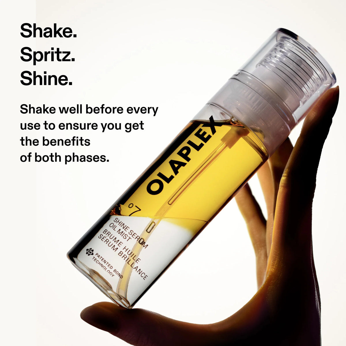 Olaplex hair serum bottle held by a hand with text instructions on a white background