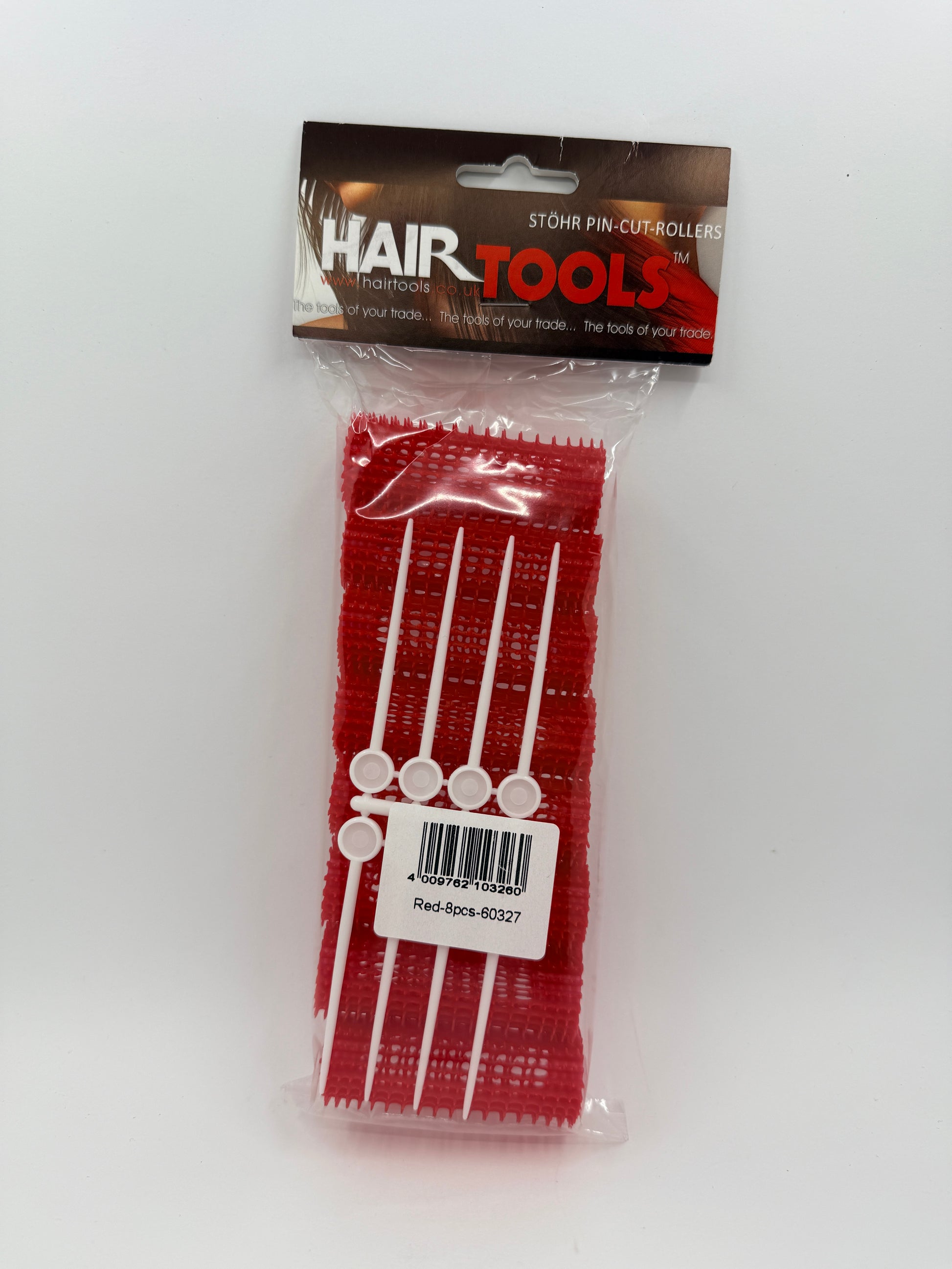 Packaged hair tools with a clear plastic cover on a white background