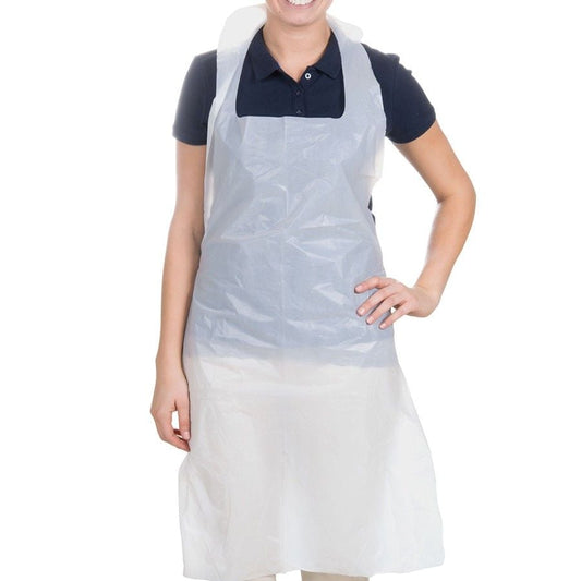 Person wearing a white disposable apron on a white background