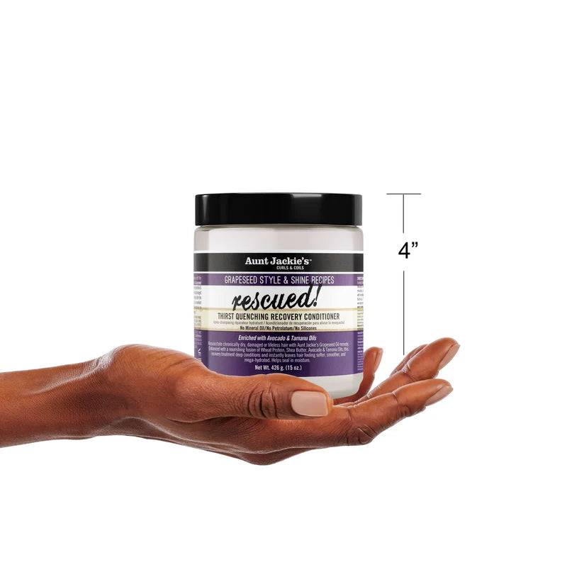Hand holding a jar of 'rescued!' conditioner with a measurement label on a white background