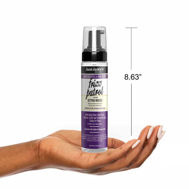 Bottle of Aunt Jackie's setting mousse held in a hand with dimensions displayed.