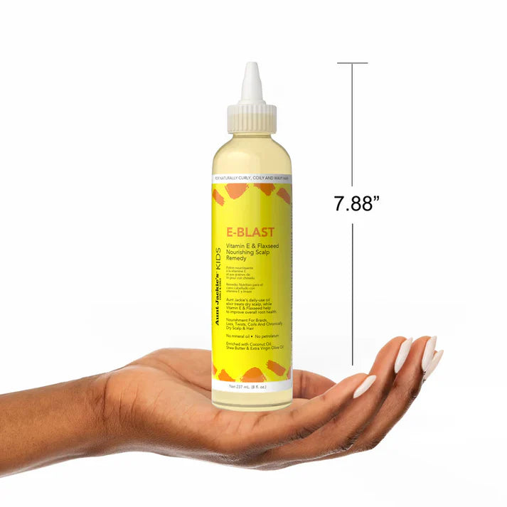 Bottle of E-Blast product held in a hand with dimensions displayed