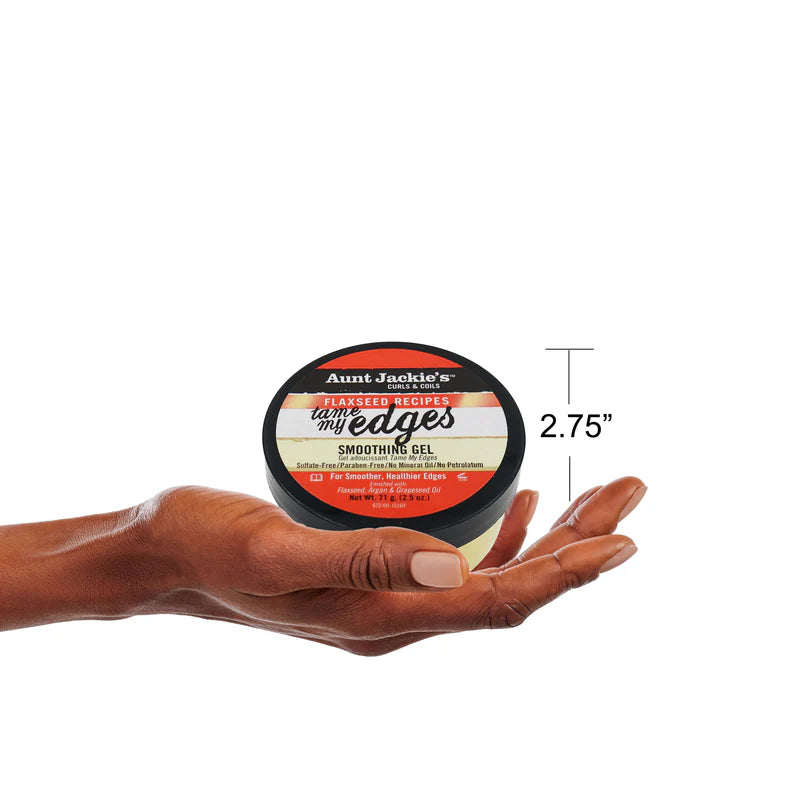 Hand holding a container of Aunt Jackie's product with dimensions displayed