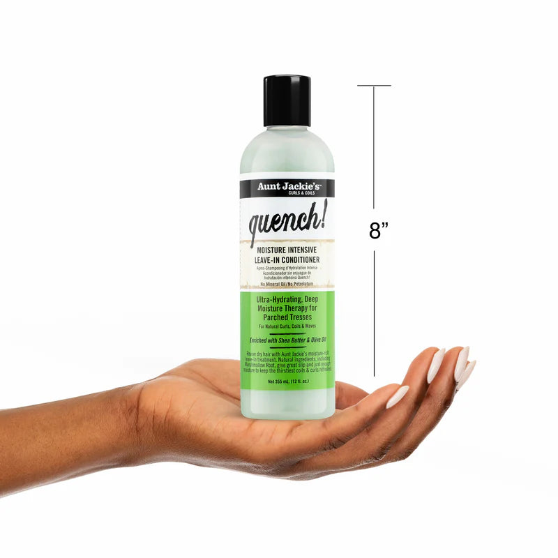 Bottle of Aunt Jackie's Quench leave-in conditioner held in a hand with a white background