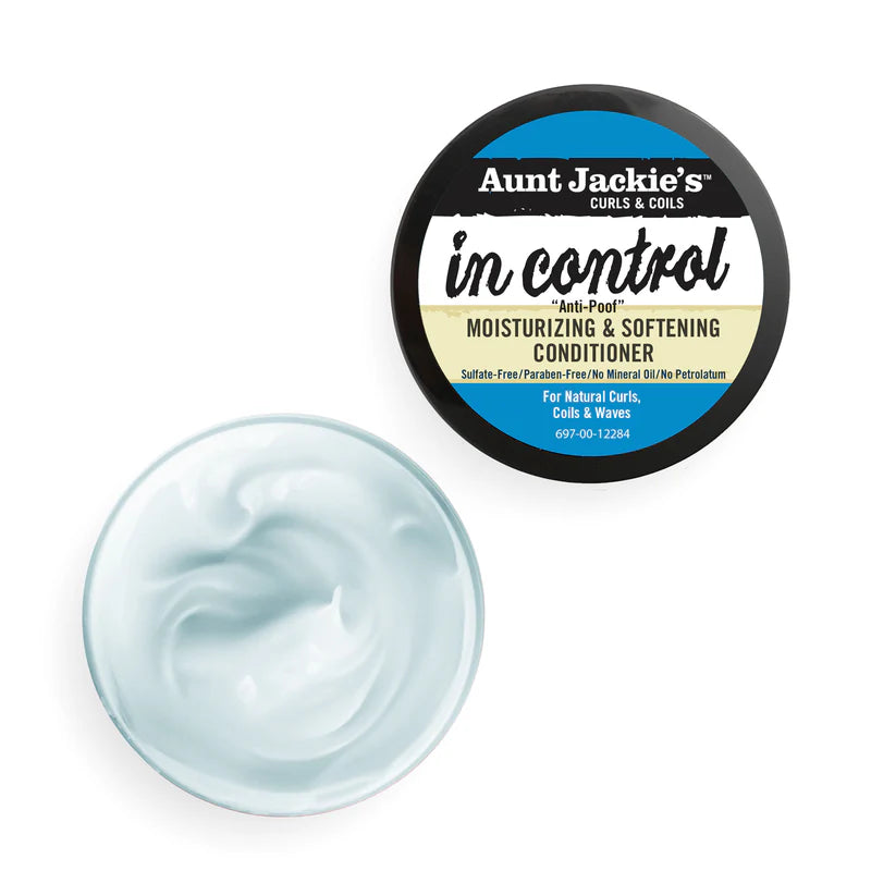 Aunt Jackie's Curls & Coils conditioner jar with a sample of the product on a white background