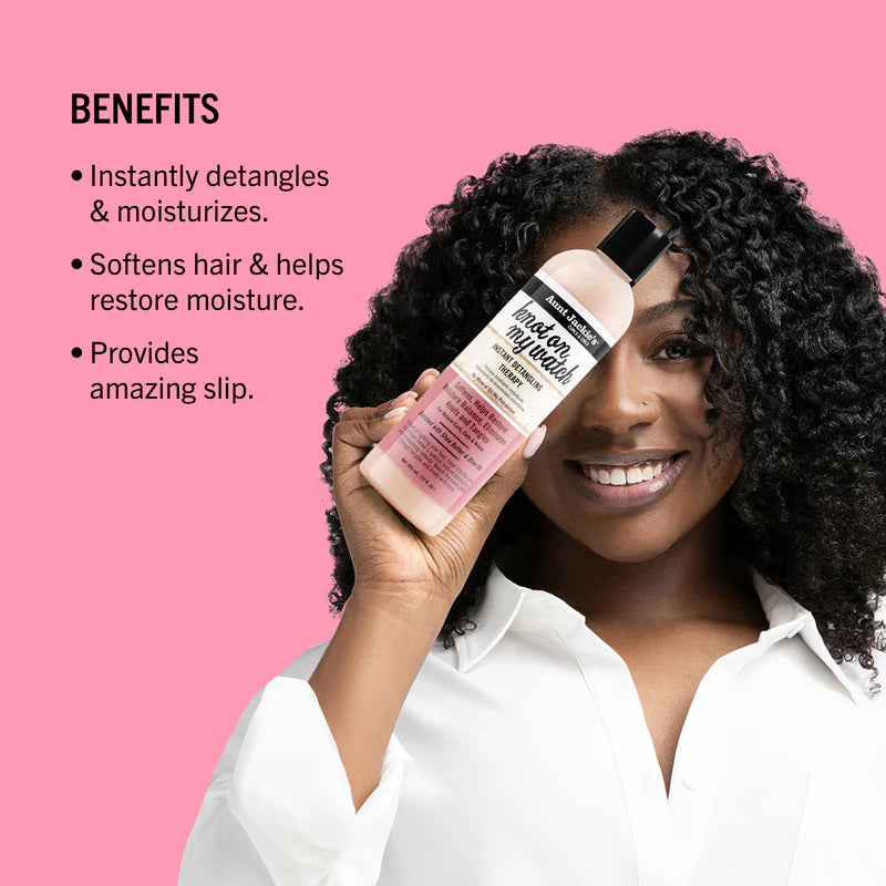 Woman holding a hair product with benefits listed on a pink background