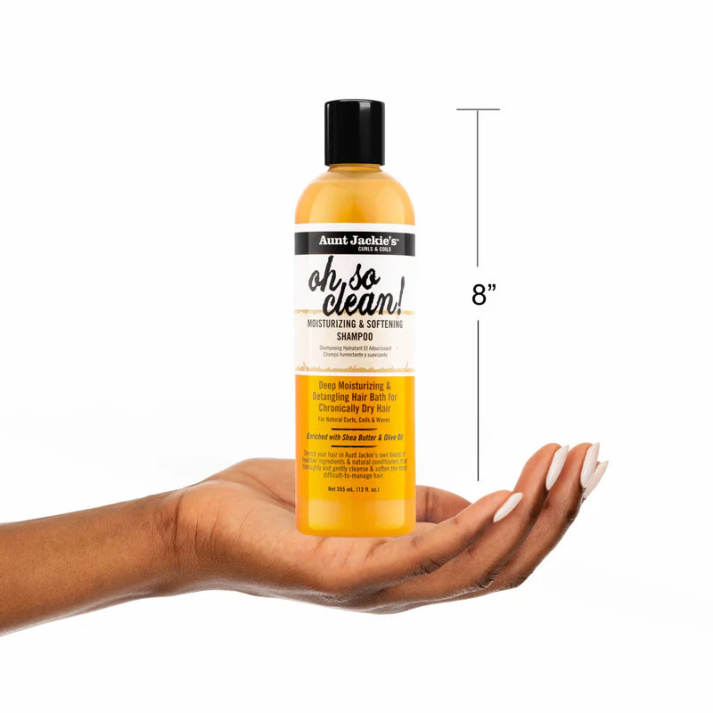 Aunt Jackie's oh so clean shampoo bottle held in a hand with a measurement label on a white background