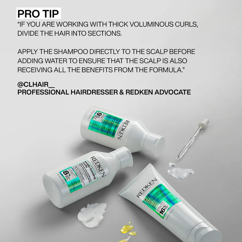 Redken hair care products with application tips on a gray background