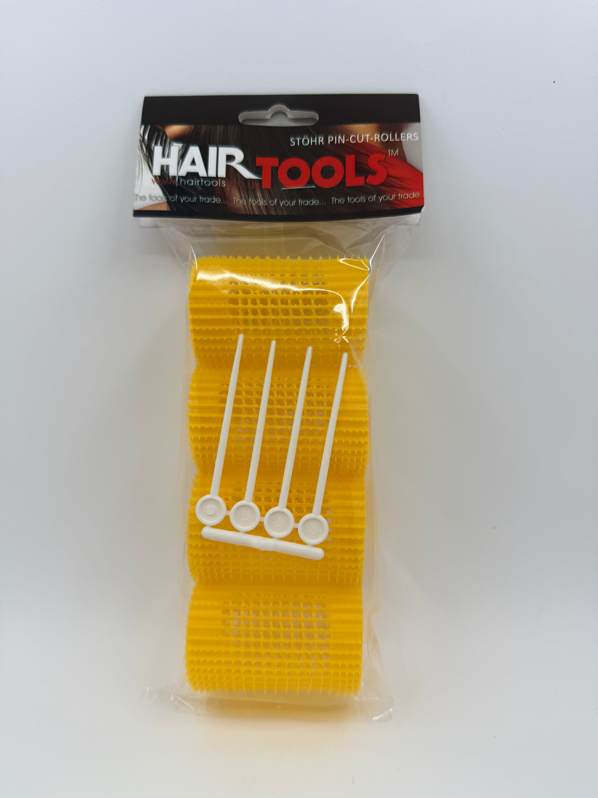 Yellow hair tool with packaging on a white background