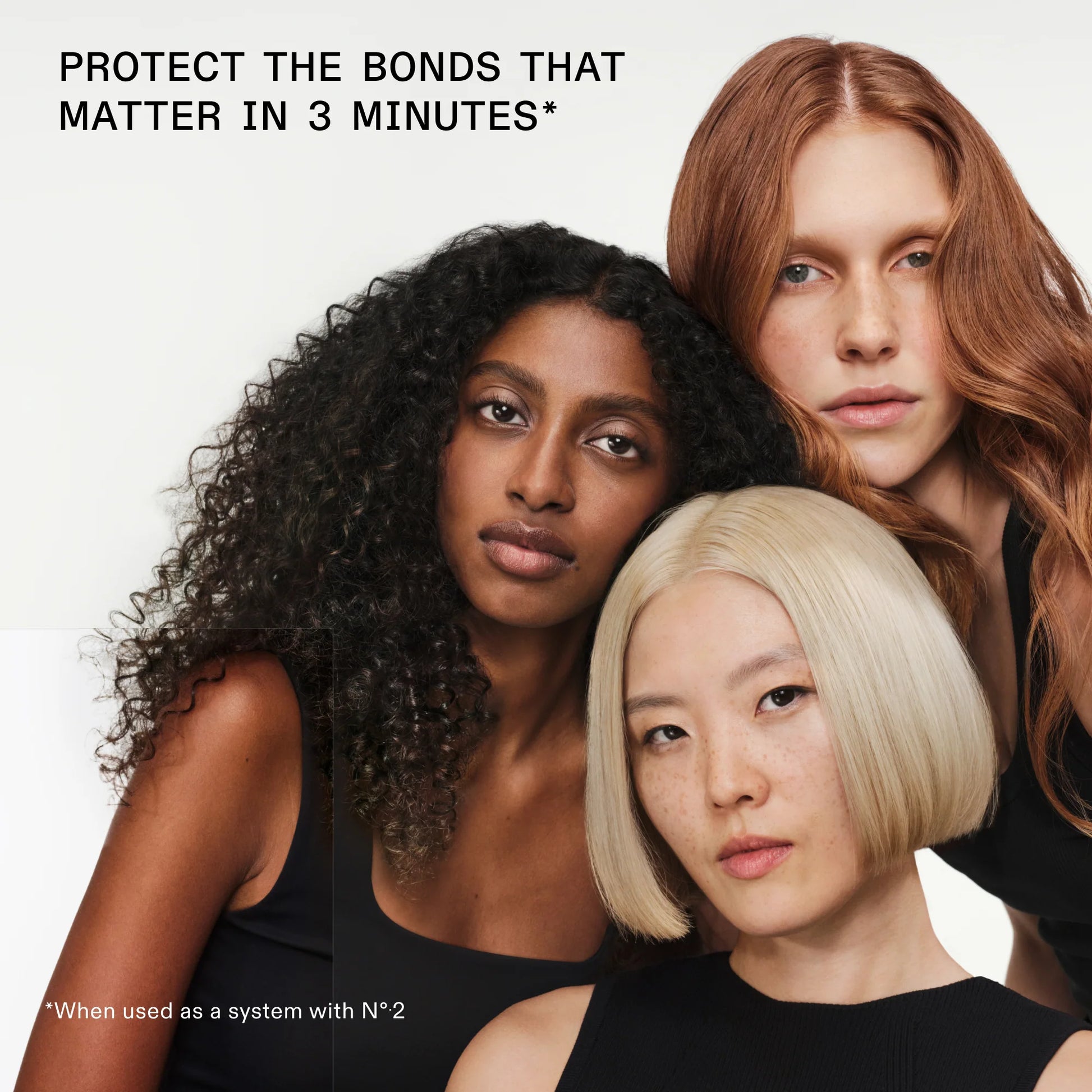 Three women with different hair colors standing close together against a white background.