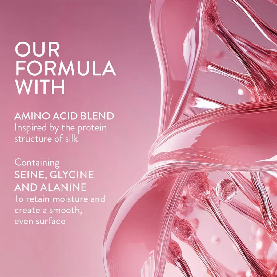 Pink promotional graphic with white text reading 'OUR FORMULA WITH Amino Acid Blend Inspired by the protein structure of silk' and 'Containing Seine, Glycine and Alanine To retain moisture and create a smooth, even surface,' alongside a glossy pink abstract silk-like form on a pink background.