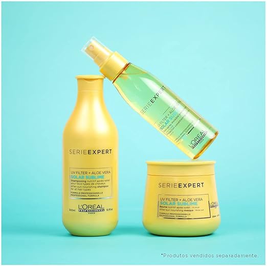L'Oreal Serie Expert hair care products on a turquoise background