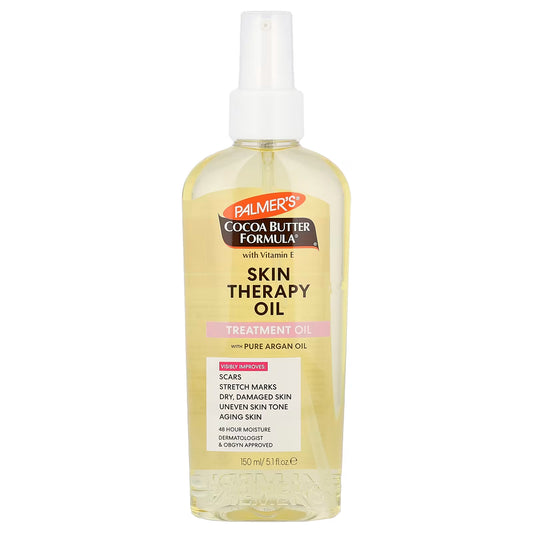 A bottle of Palmer's Cocoa Butter Formula Skin Therapy Oil with pure argan oil, featuring a white spray pump and a clear bottle showing the pale yellow oil inside, set against a plain white background.