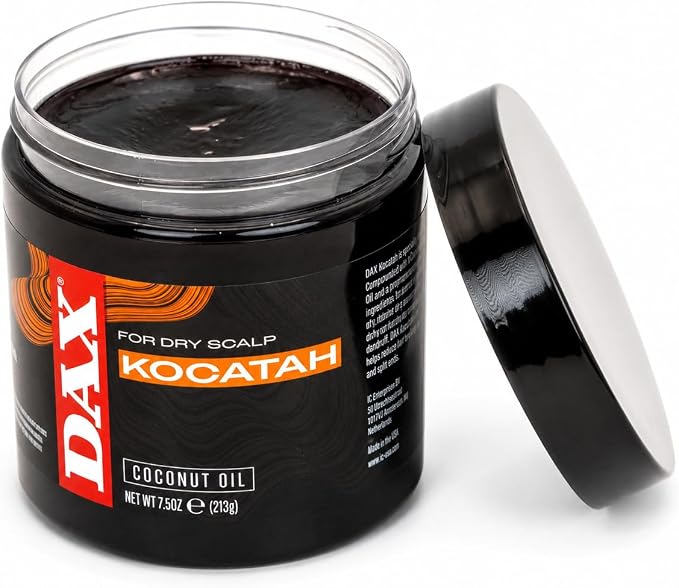 A jar of DAX Kocatah Coconut Oil hair growth shampoo for dry scalp, shown open with its black lid leaning against it on a white background.
