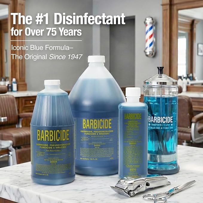 Barbicide disinfectant bottles on a counter with a barber shop background