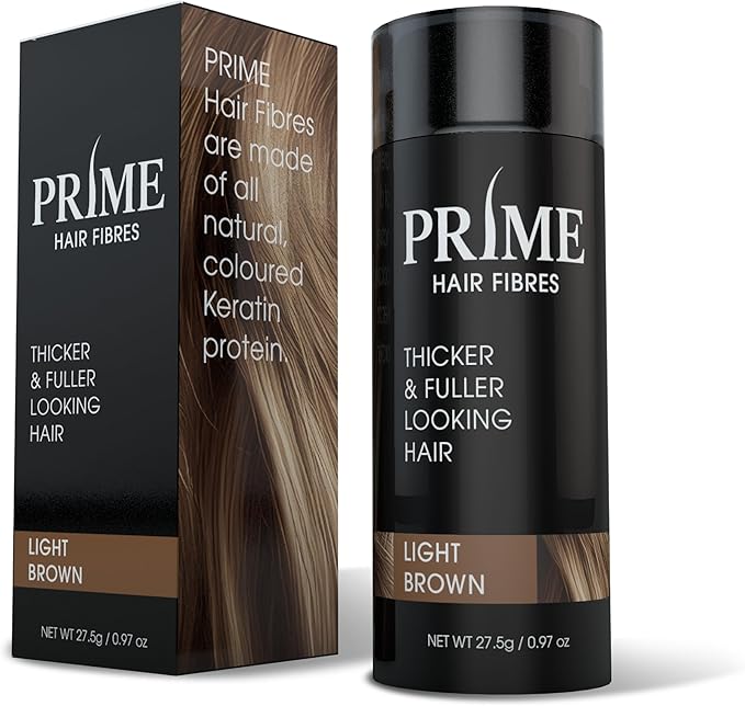 PRIME Hair Fibres Thickener & Fuller Looking Hair stick in Light Brown, shown with its black and brown packaging box and the black cylindrical container on a white background.