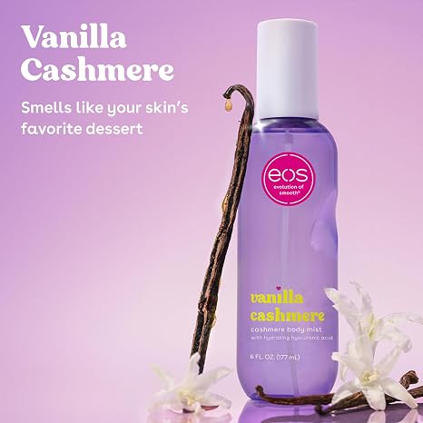 EOS Vanilla Cashmere body mist bottle with vanilla bean and flowers on a purple background