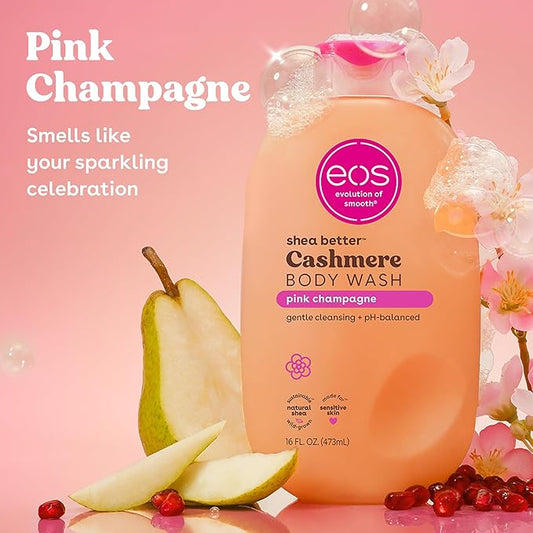 EOS shea butter Cashmere Body Wash bottle with pink champagne scent on a pink background with pears and flowers.