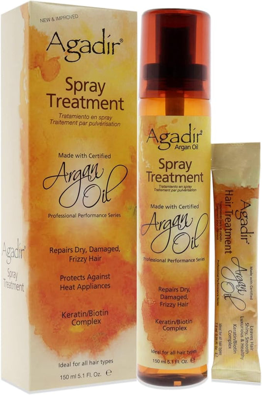 Agadir Argan Oil Spray Treatment set, including a tall amber spray bottle with a red cap, its matching yellow and orange outer box, and a small hair treatment packet, all on a white background.