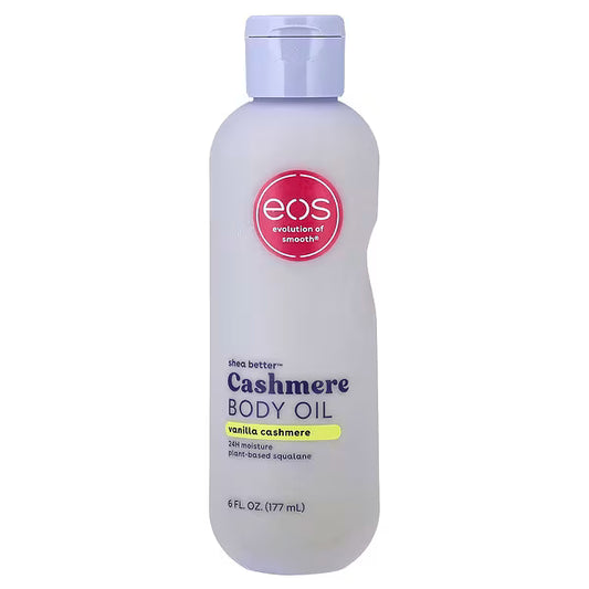 A 6 fl oz bottle of EOS Cashmere Body Oil in vanilla cashmere scent, featuring a frosted white bottle with a lavender cap and a pink circular logo.