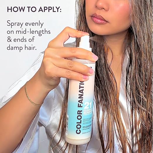 A woman holds a can of Color Fanatic 21 Hair Color Enhancing Spray against her wet hair, with text on the left explaining how to apply the spray.