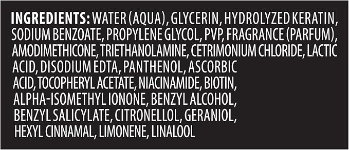 A black square label with white text listing ingredients, including water, glycerin, hydrolyzed keratin, sodium benzoate, propylene glycol, PVP, fragrance, amodimethicone, triethanolamine, cetrimonium chloride, lactic acid, disodium edta, panthenol, ascorbic acid, tocopheryl acetate, niacinamide, biotin, alpha-isomethyl ionone, benzyl alcohol, benzyl salicylate, citronellol, geraniol, hexyl cinnamon, limonene, and linalool.