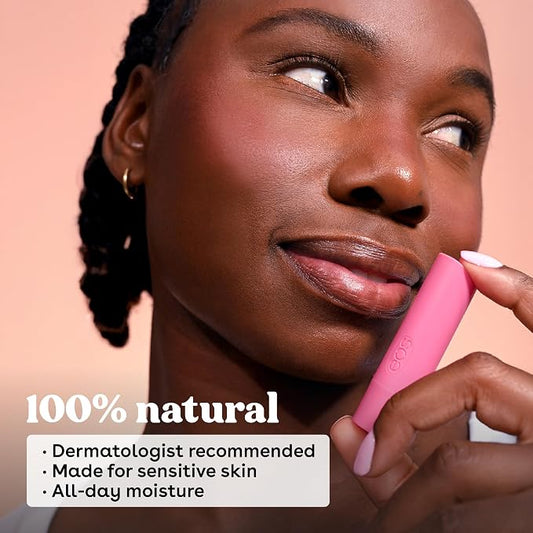 Woman applying pink lip balm with product details on a peach background
