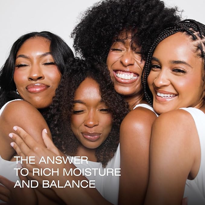Four women with natural hairstyles smiling together, with text about rich moisture and balance.