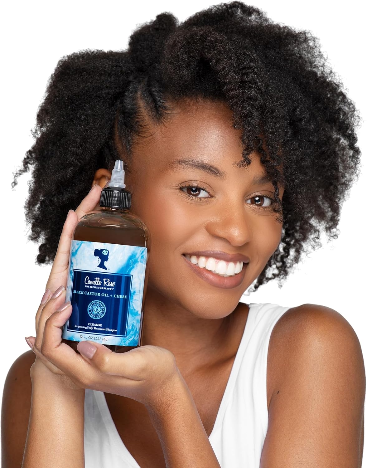 Woman holding a bottle of Cullen Root hair product against a white background