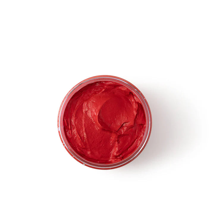 Red gel in a transparent container on a white background