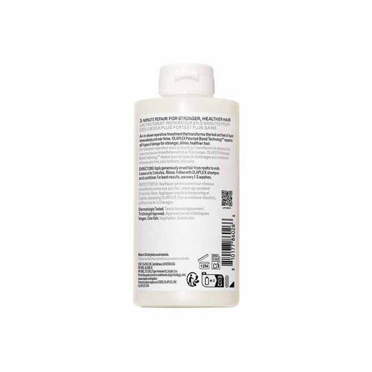 Back label of a hair care product bottle on a white background