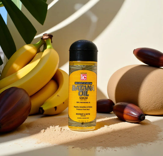 Batana Oil Serum bottle with bananas and oil seeds on a light background