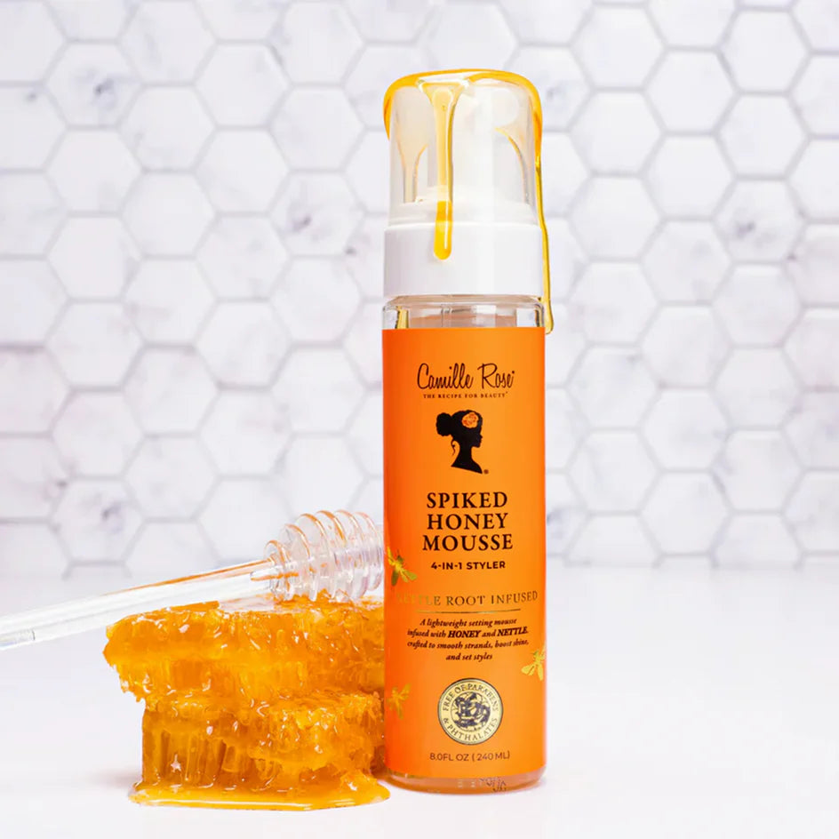 Camille Rose Spiked Honey Mousse bottle with mousse on a white background