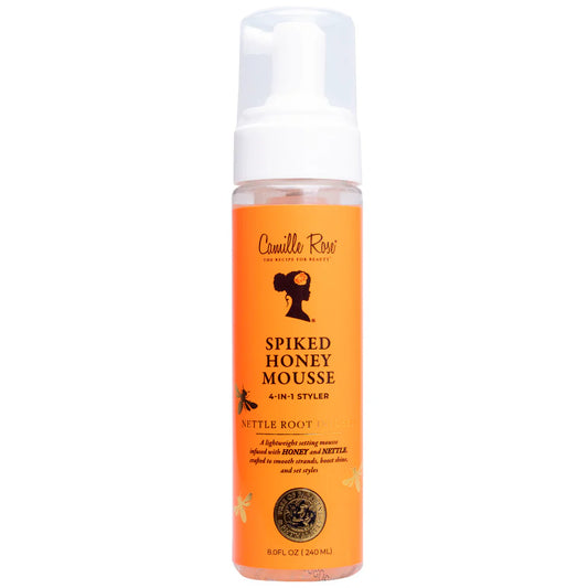 Orange bottle of Camille Rose Spiked Honey Mousse on a white background
