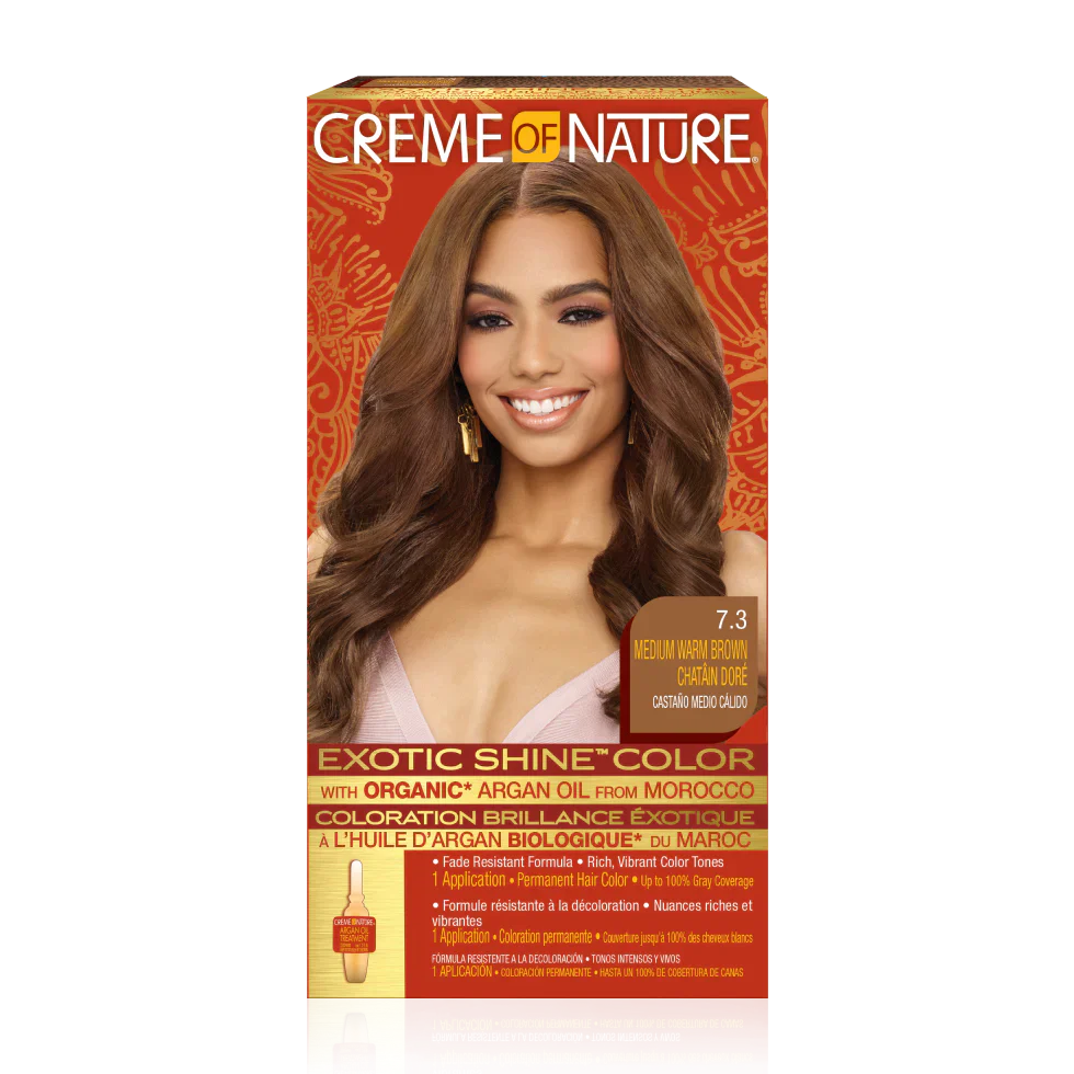 Creme of Nature Exotic Shine Color hair dye box in shade 7.3 Medium Warm Brown, featuring a model with long wavy brown hair on the front.