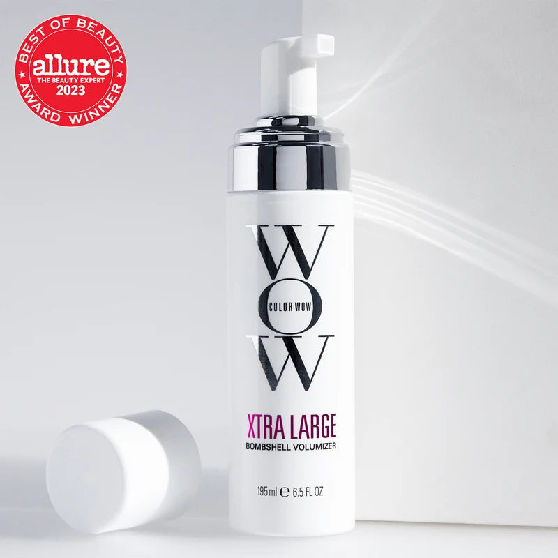Bottle of WOW XTRA LARGE Bombshell Volumizer with 'Allure' Best of Beauty Award 2023 logo on a white background