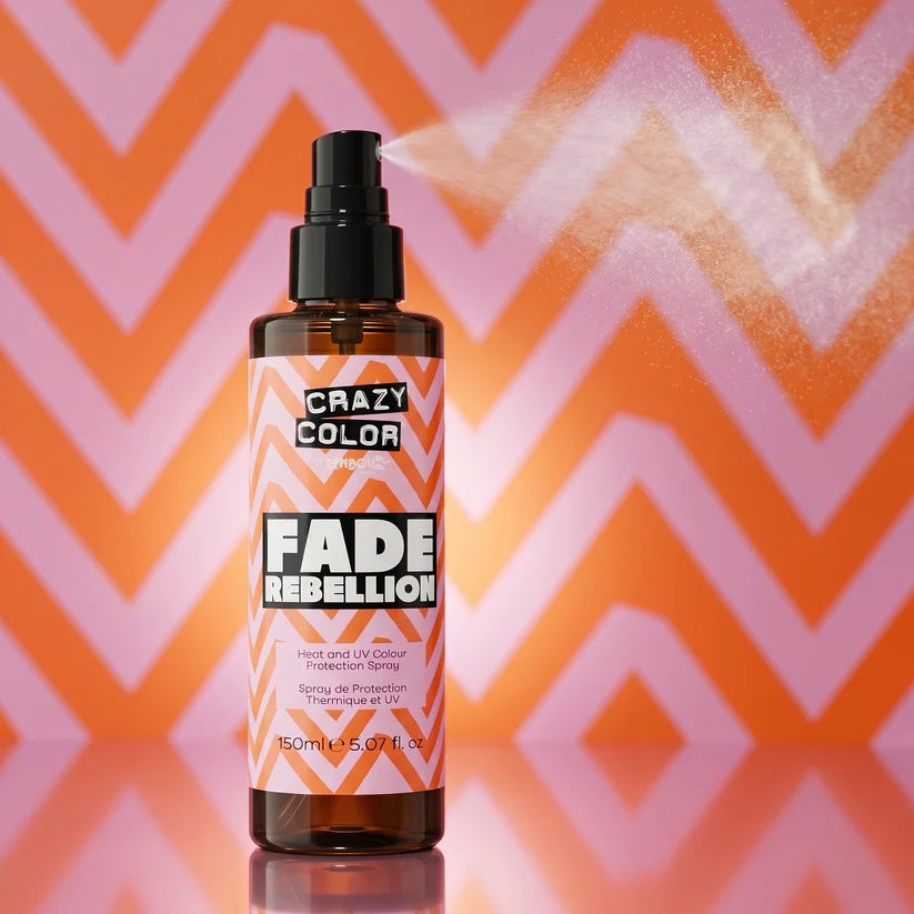 Crazy Color Fade Rebellion spray bottle on a colorful zigzag background