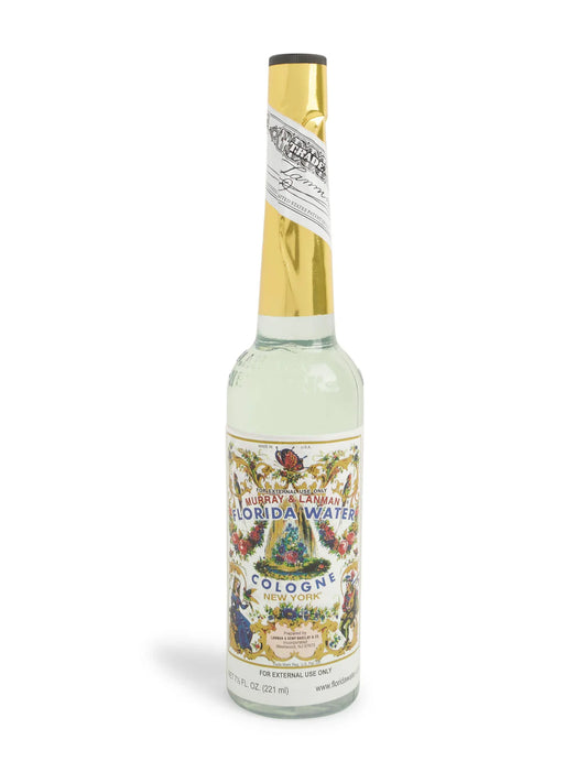 Bottle of Florida Water cologne with decorative label on a white background
