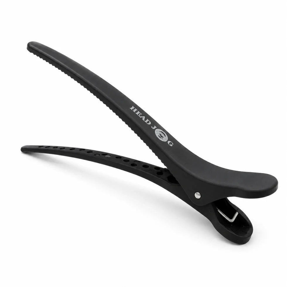 Black hair clip with 'HEAD' branding on a white background