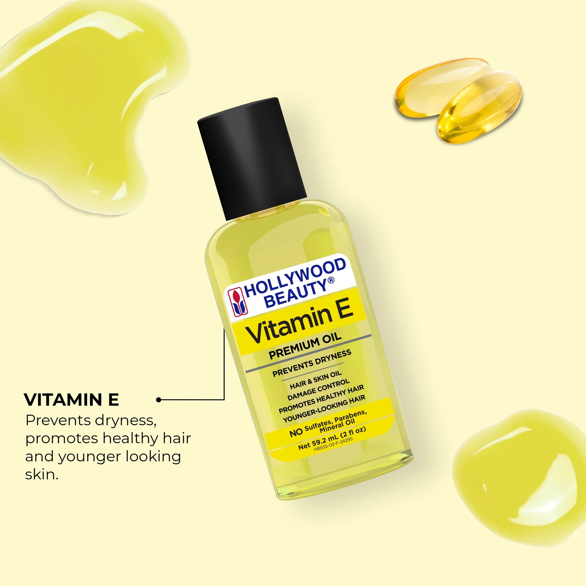 Hollywood Beauty Vitamin E oil bottle with droplets on a light yellow background