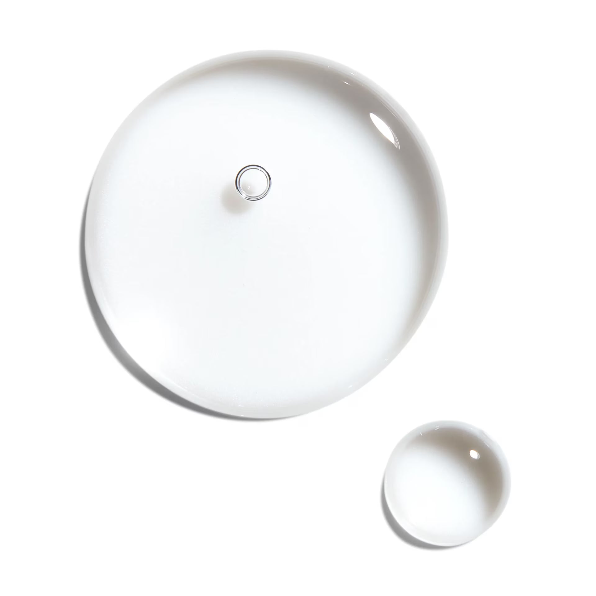 Two white ceramic lids on a white background