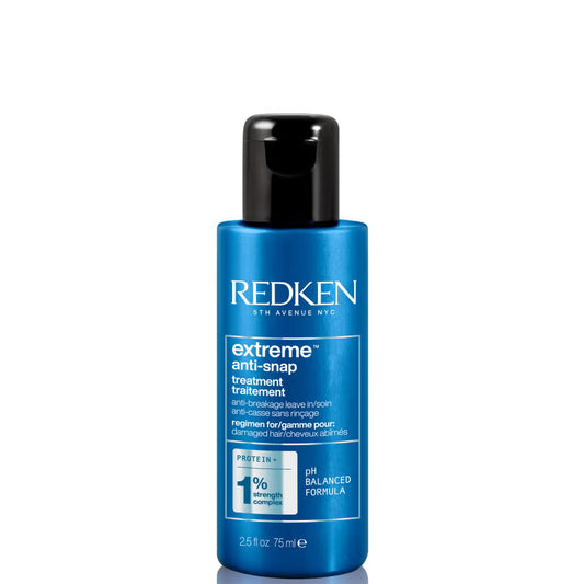 Blue bottle of Redken extreme anti-snap treatment on a white background