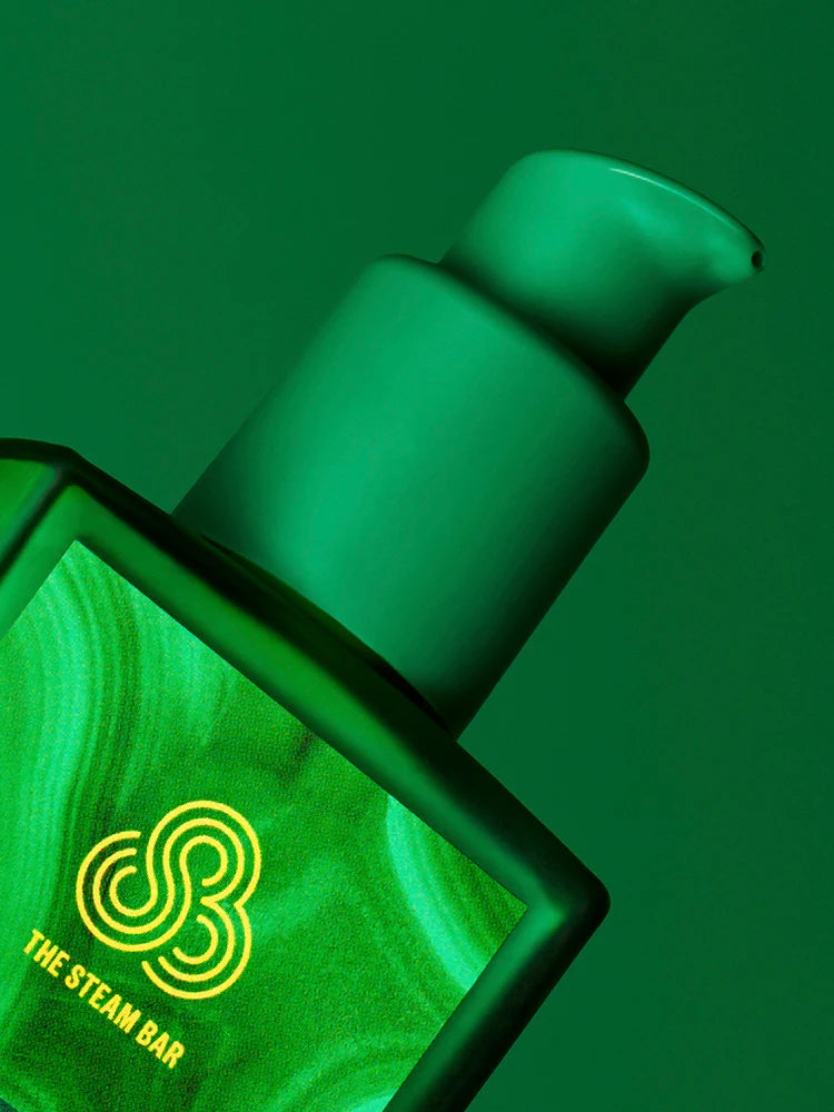 Green bottle with pump and 'The Steam Bar' logo on a green background