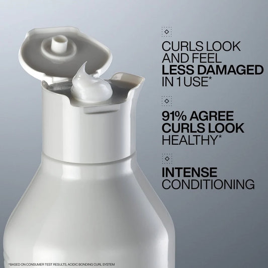 White hair care product bottle with text on a gray background