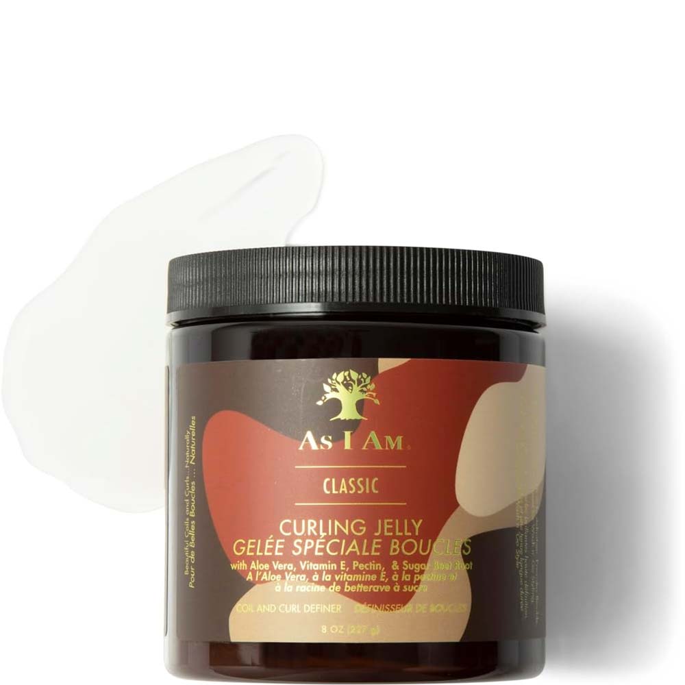 A jar of As I Am Classic Curling Jelly on a white background with a translucent curl-shaped gel swatch behind it. The jar is dark brown with a black lid and a label featuring brown, beige, and gold abstract shapes.